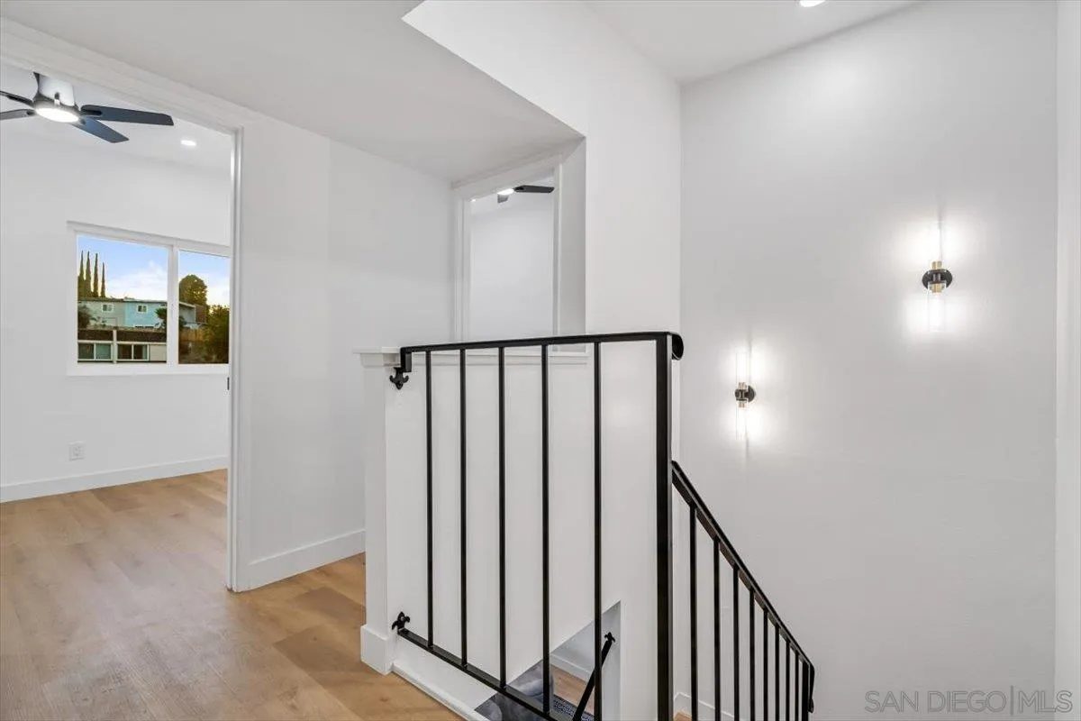 13259 Saddle Ridge Road Lakeside, CA 92040 - Photo 33 of 57 a view of a hallway with wooden floor and staircase