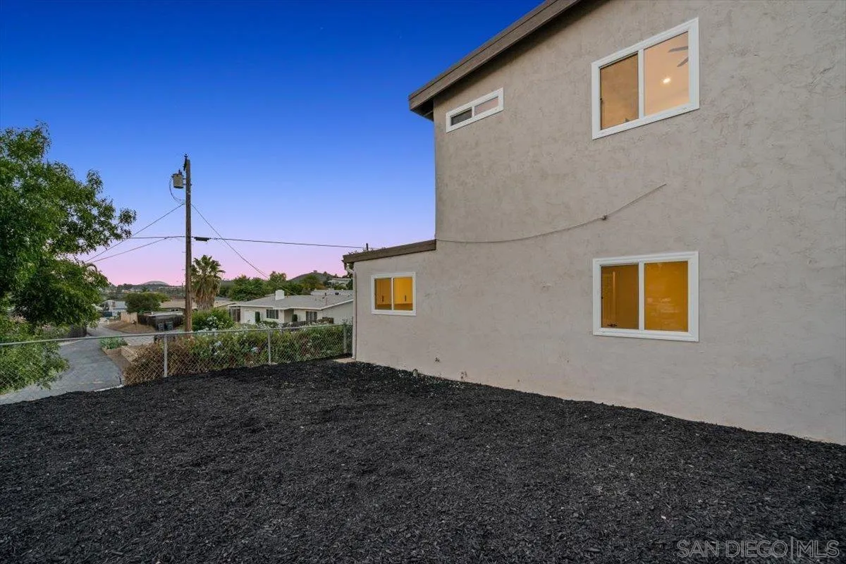 13259 Saddle Ridge Road Lakeside, CA 92040 - Photo 47 of 57 a view of a house with backyard and a tree