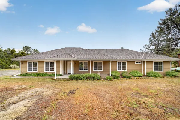 front view of a house with a yard
