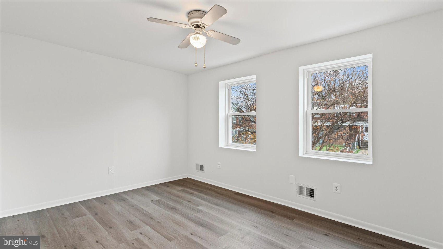 1408 Locust Street Curtis Bay, MD 21226 - Photo 13 of 35 wooden floor in an empty room with a window