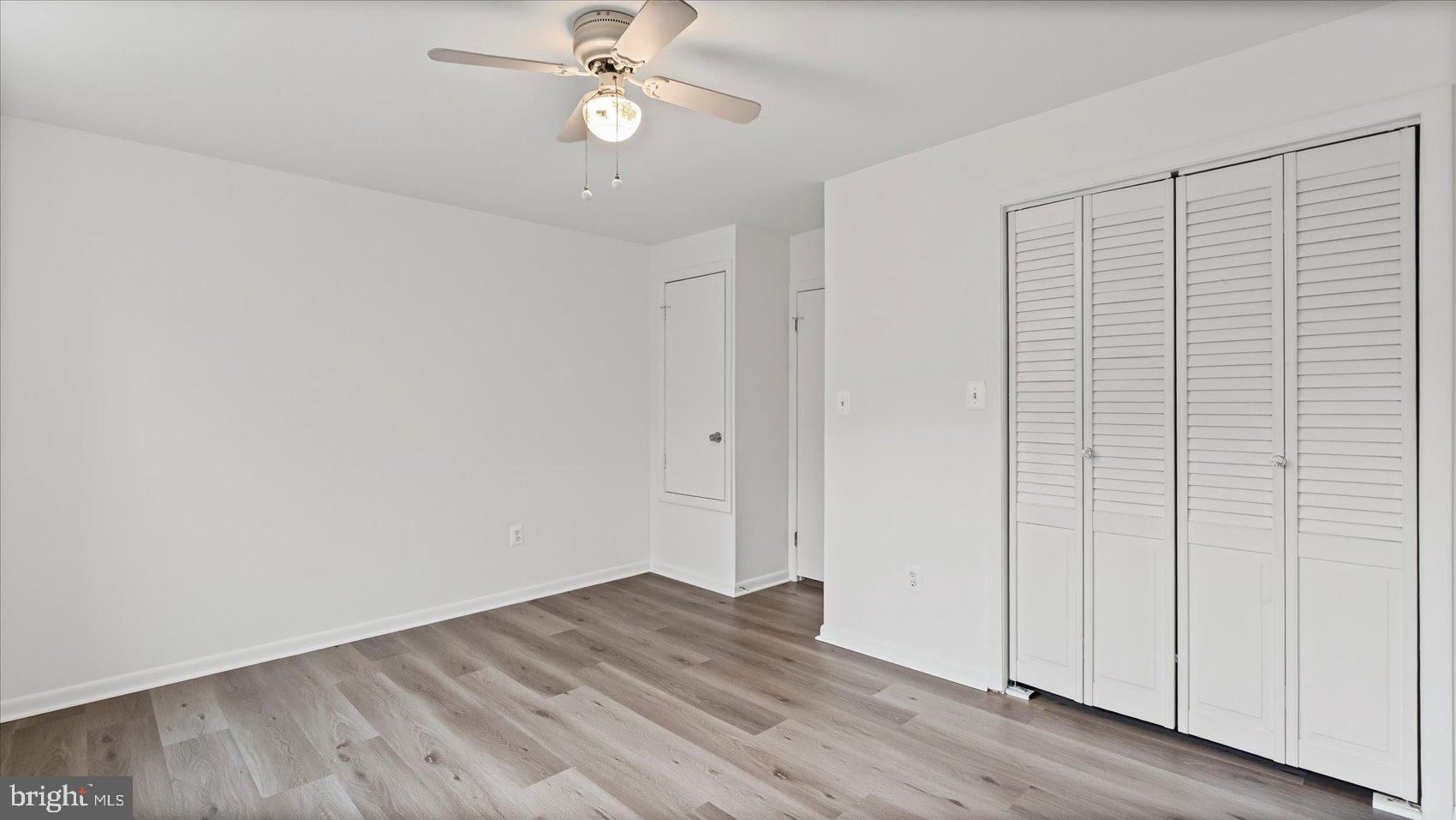 1408 Locust Street Curtis Bay, MD 21226 - Photo 15 of 35 wooden floor in an empty room with a window