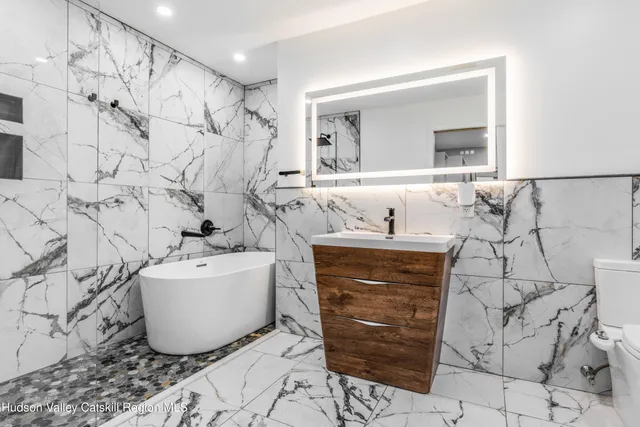 a bathroom with a sink and mirror