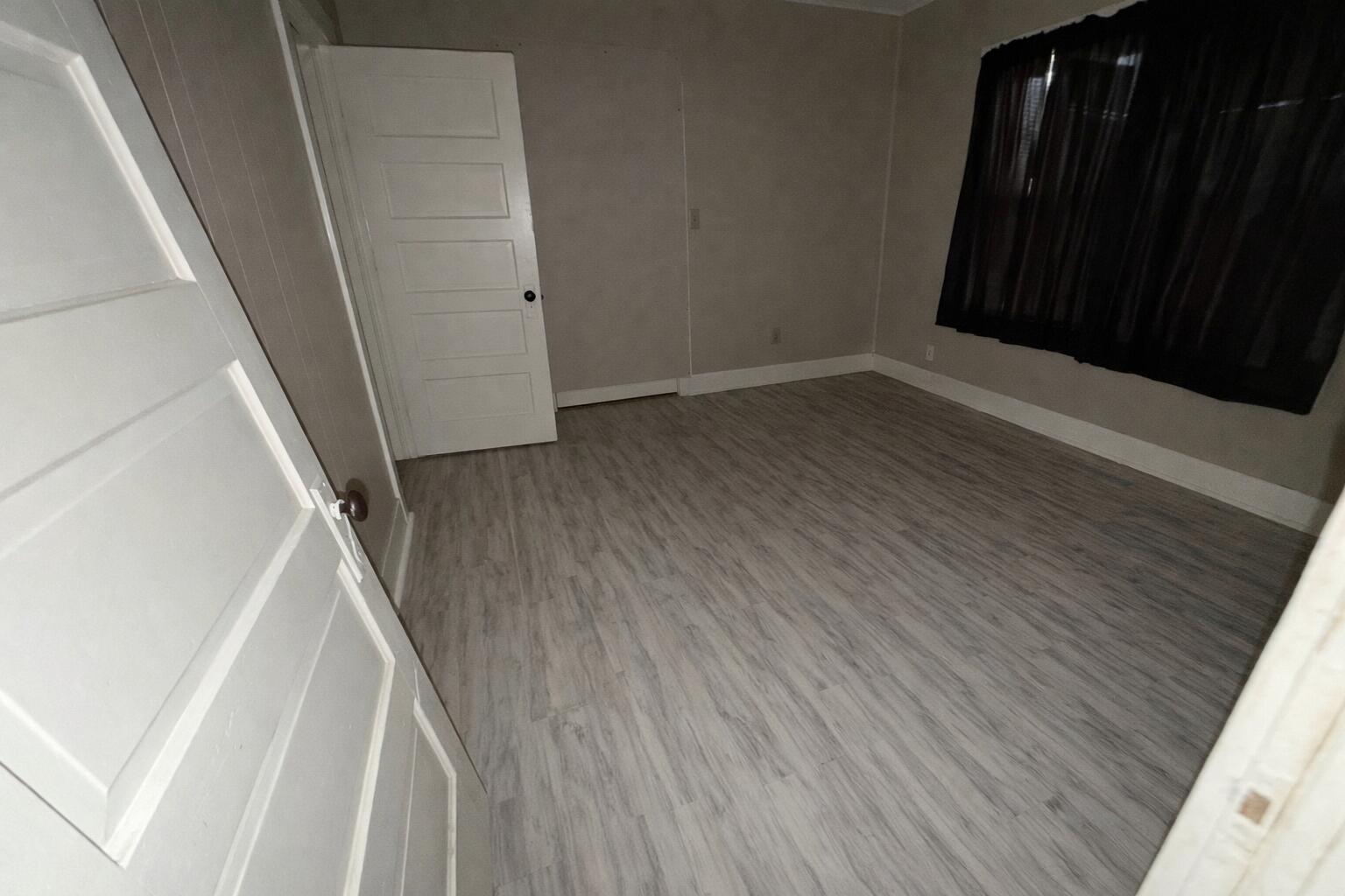 2410 Fisher Street Plainview, TX 79072 - Photo 5 of 8 a view of entryway with wooden floor