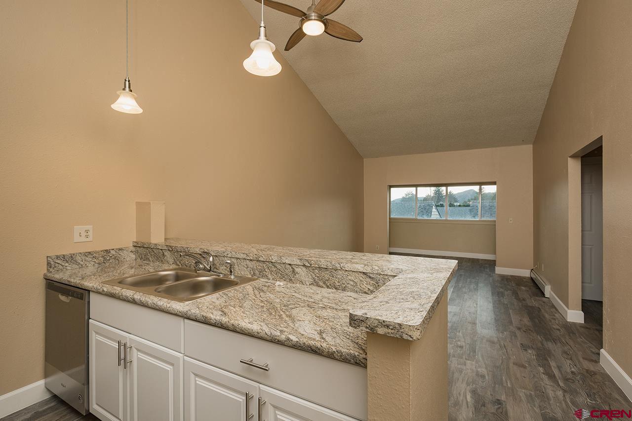 1135 Florida Road, Unit C23 Durango, CO 81301 - Photo 1 of 18 wooden floor in an empty room with a window