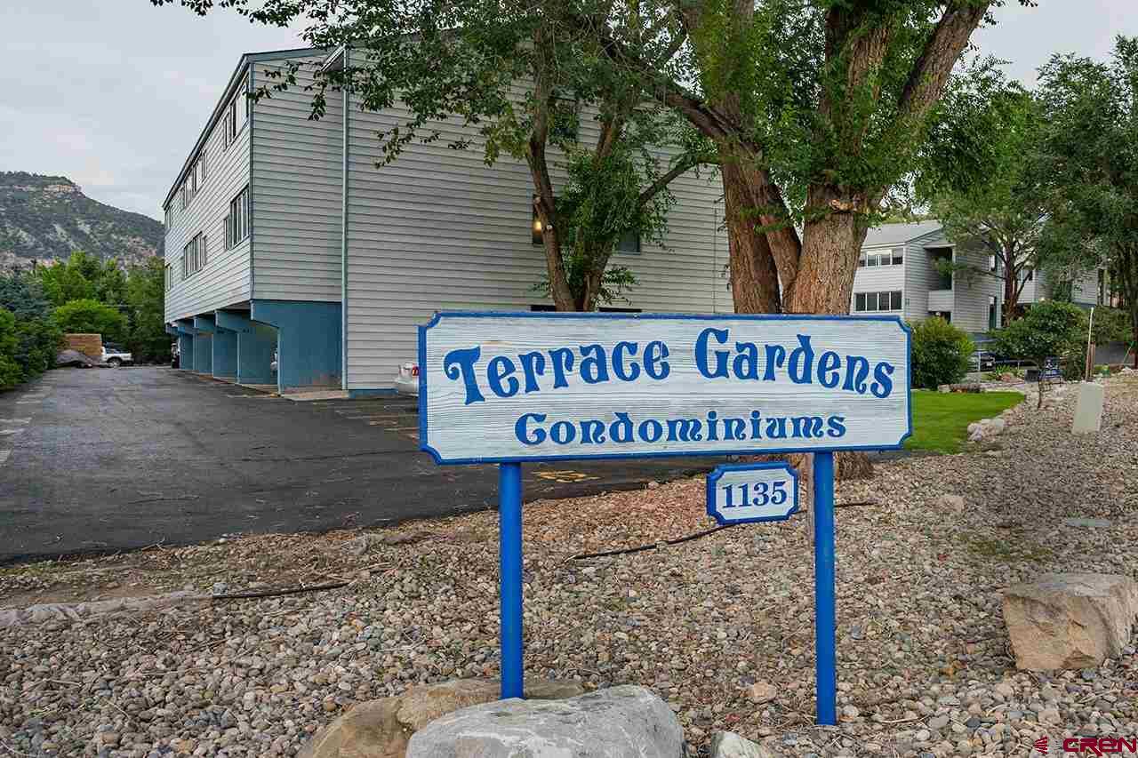 1135 Florida Road, Unit C23 Durango, CO 81301 - Photo 18 of 18 a view of a street sign under a large tree
