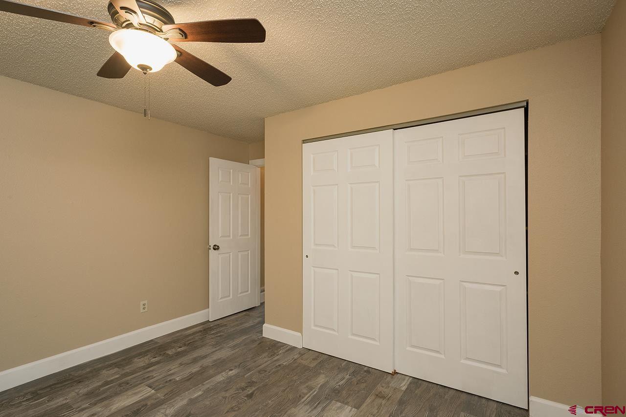 1135 Florida Road, Unit C23 Durango, CO 81301 - Photo 3 of 18 an empty room with a chandelier fan