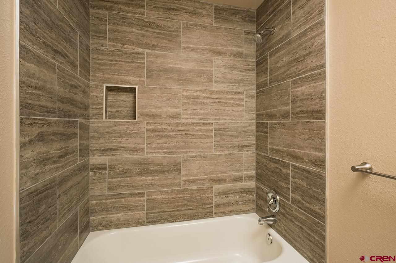 1135 Florida Road, Unit C23 Durango, CO 81301 - Photo 5 of 18 a bathroom with a shower