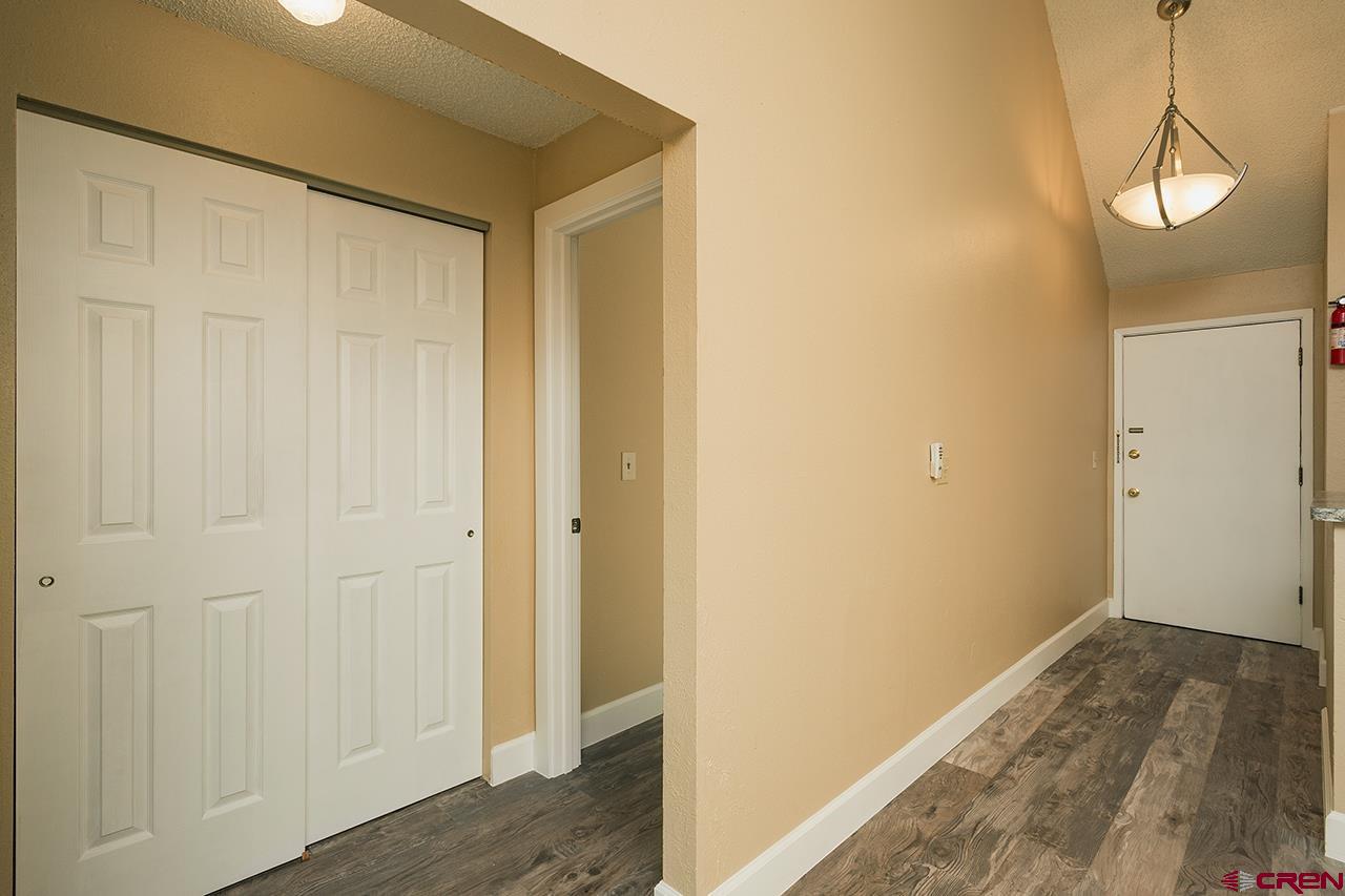 1135 Florida Road, Unit C23 Durango, CO 81301 - Photo 7 of 18 a view of a hallway with wooden floor