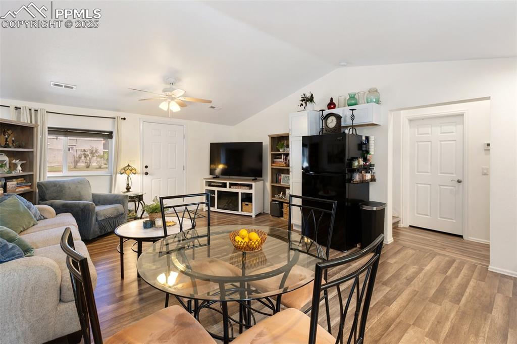 303 East 7th Street Florence, CO 81226 - Photo 15 of 39 a view of a dining room with furniture and wooden floor