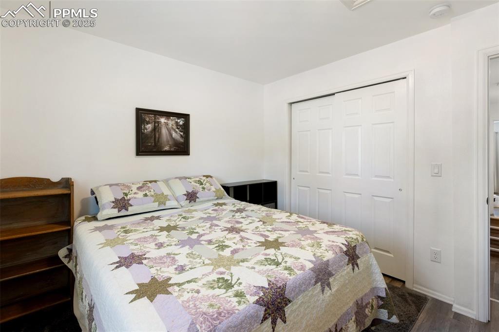 303 East 7th Street Florence, CO 81226 - Photo 20 of 39 a bedroom with a bed and a painting on the wall