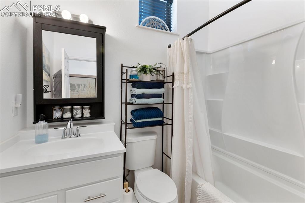 303 East 7th Street Florence, CO 81226 - Photo 22 of 39 a bathroom with a sink a toilet and shower