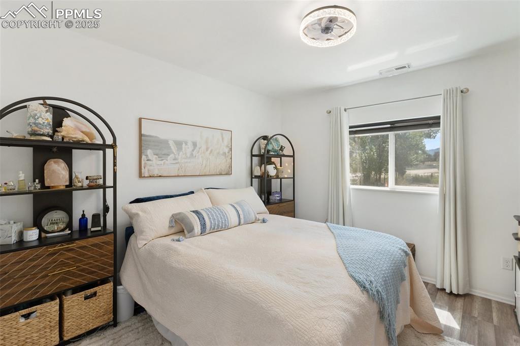 303 East 7th Street Florence, CO 81226 - Photo 23 of 39 a bedroom with a bed and a window