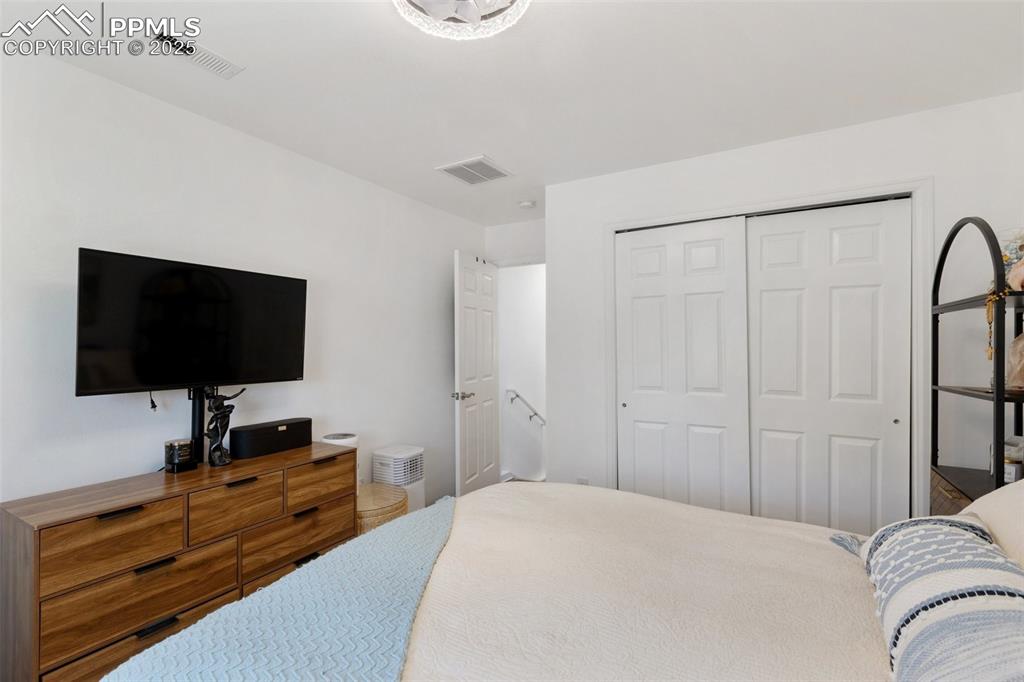 303 East 7th Street Florence, CO 81226 - Photo 25 of 39 a bedroom with a bed and a flat screen tv