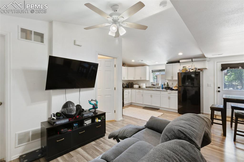 303 East 7th Street Florence, CO 81226 - Photo 27 of 39 a living room with furniture and a flat screen tv