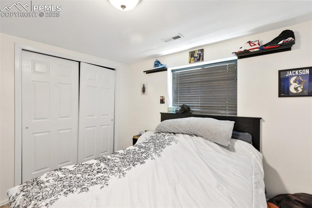 303 East 7th Street Florence, CO 81226 - Photo 29 of 39 a bedroom with a bed and a window