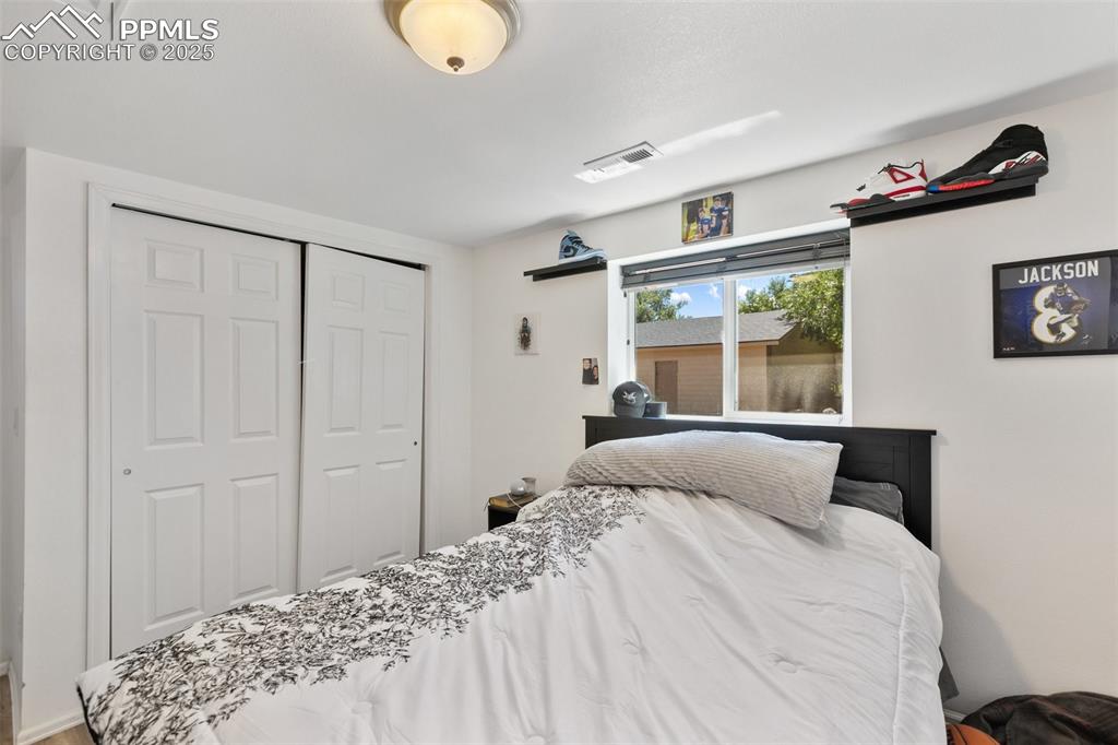 303 East 7th Street Florence, CO 81226 - Photo 31 of 39 a bedroom with a bed and a window