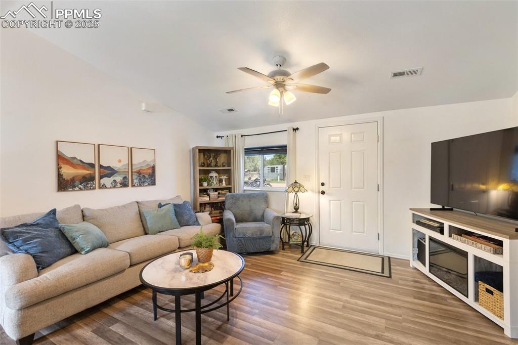 303 East 7th Street Florence, CO 81226 - Photo 8 of 39 a living room with furniture a ceiling fan and a rug
