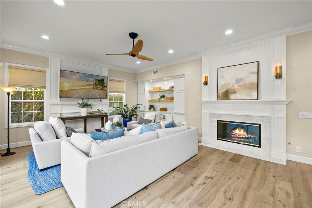 16 Wyndham Street Ladera Ranch, CA 92694 - Photo 16 of 58 a living room with furniture and a fireplace
