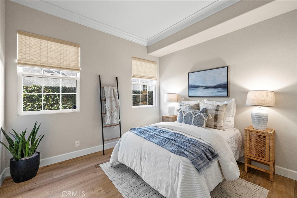 16 Wyndham Street Ladera Ranch, CA 92694 - Photo 18 of 58 a bedroom with a large bed and a window