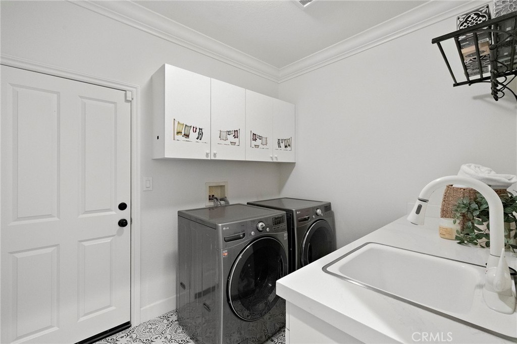 16 Wyndham Street Ladera Ranch, CA 92694 - Photo 21 of 58 a utility room with sink dryer and washer