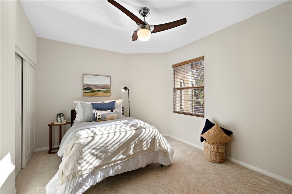 16 Wyndham Street Ladera Ranch, CA 92694 - Photo 29 of 58 a bedroom with a bed and wooden floor