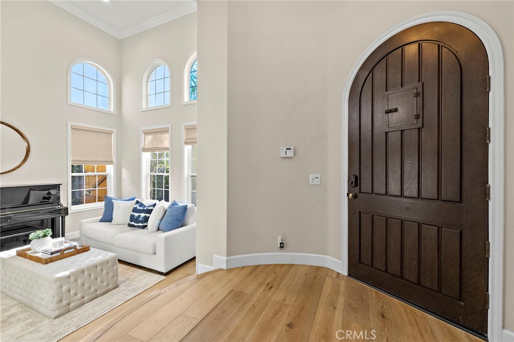 16 Wyndham Street Ladera Ranch, CA 92694 - Photo 3 of 58 a living room with furniture and a wooden floor