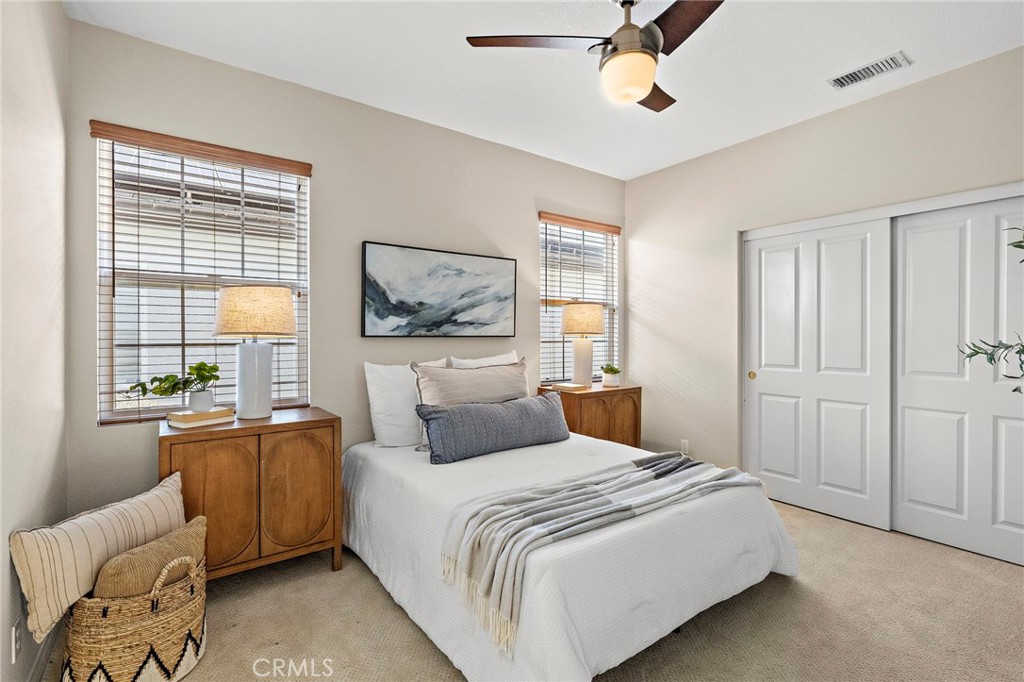 16 Wyndham Street Ladera Ranch, CA 92694 - Photo 31 of 58 a bedroom with a large bed and a couch