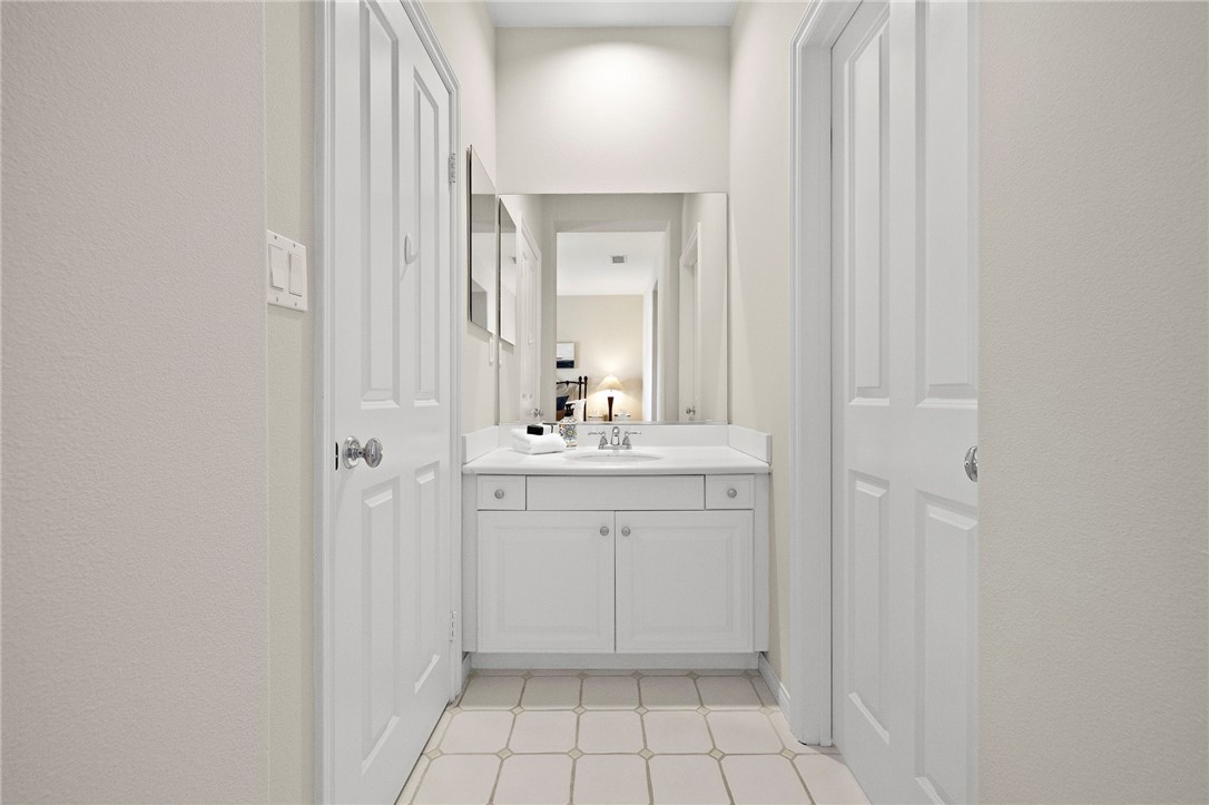 16 Wyndham Street Ladera Ranch, CA 92694 - Photo 35 of 58 a bathroom with a sink a toilet and a mirror