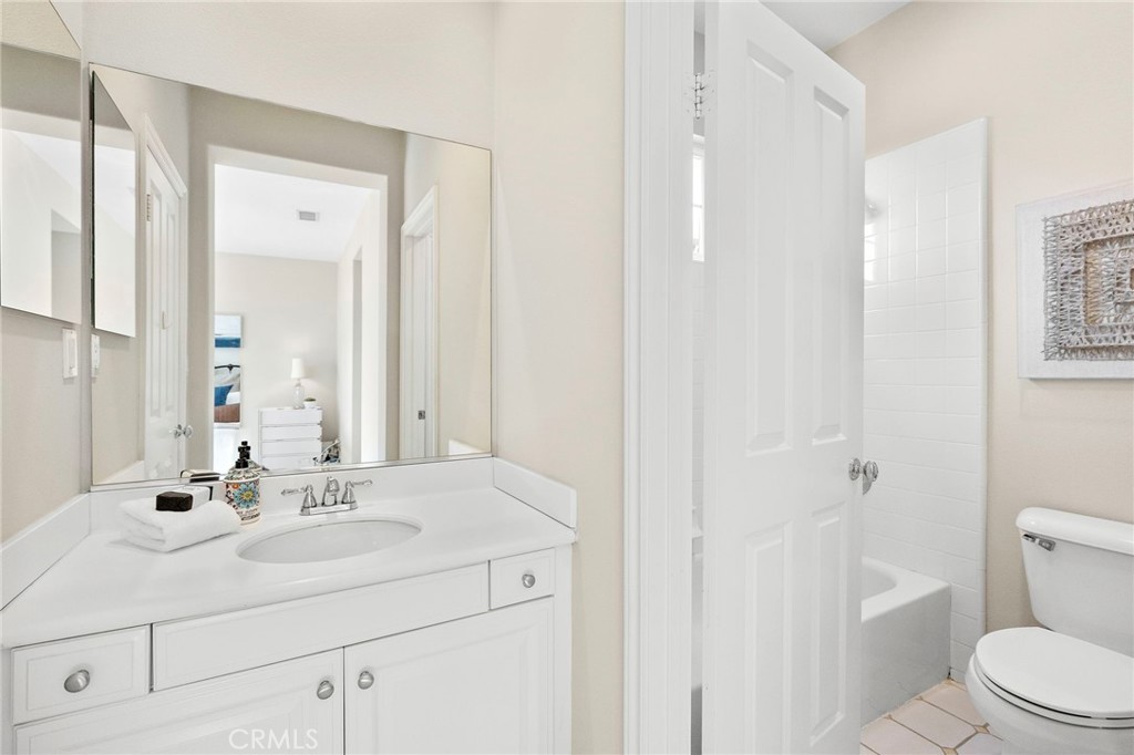 16 Wyndham Street Ladera Ranch, CA 92694 - Photo 36 of 58 a bathroom with a sink a toilet and shower