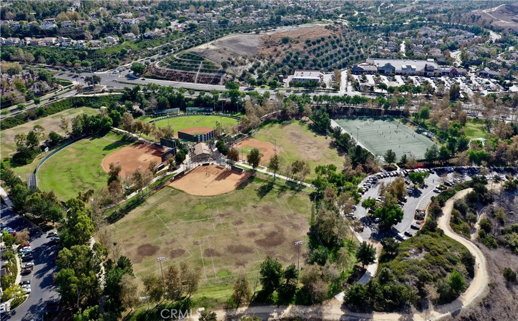 16 Wyndham Street Ladera Ranch, CA 92694 - Photo 50 of 58 an aerial view of residential houses with outdoor space and lake view