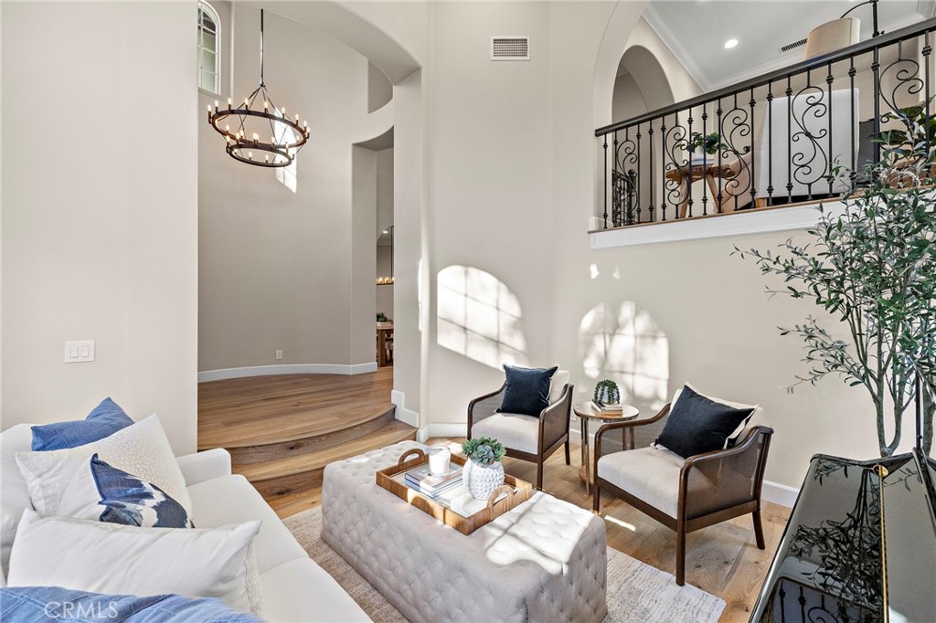 16 Wyndham Street Ladera Ranch, CA 92694 - Photo 5 of 58 a living room with furniture and wooden floor