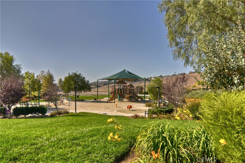 16 Wyndham Street Ladera Ranch, CA 92694 - Photo 51 of 58 a view of a house with a yard and sitting area