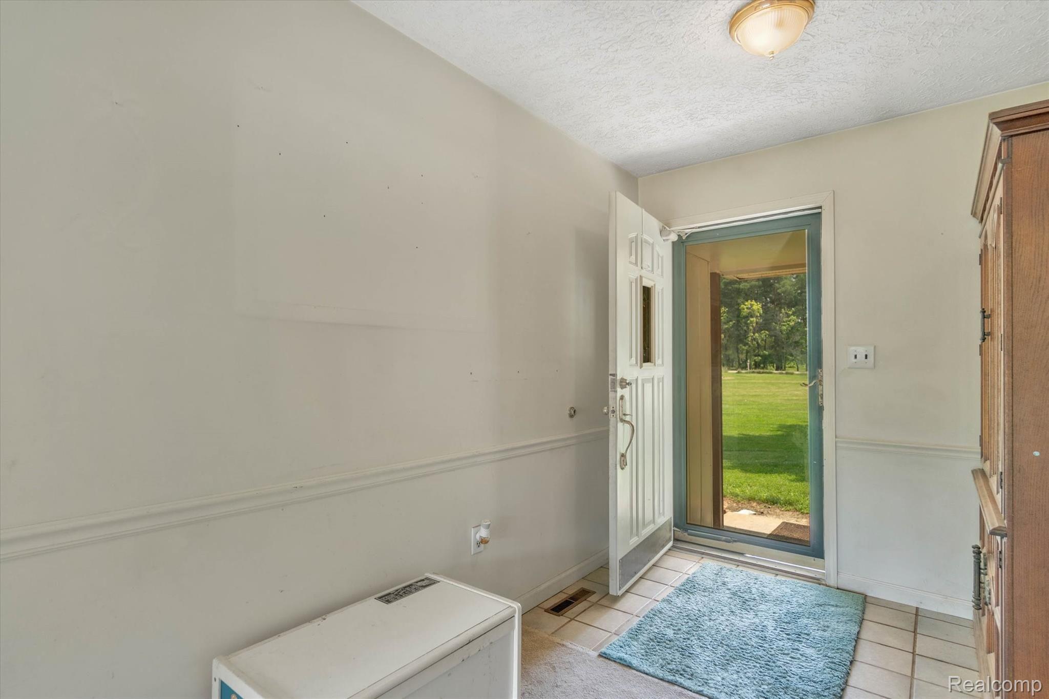 4661 Crooked Lake Road Howell, MI 48843 - Photo 6 of 47 Large Foyer Welcomes Guests