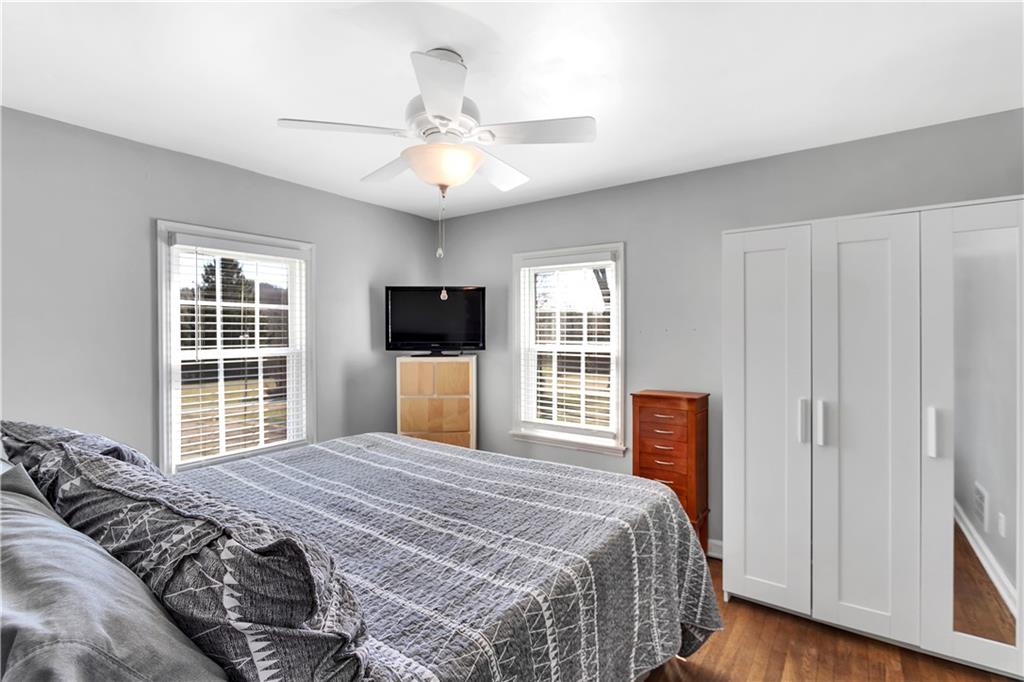 95 Mary Reed Road Baden, PA 15005 - Photo 13 of 25 a bedroom with a large bed and a tv