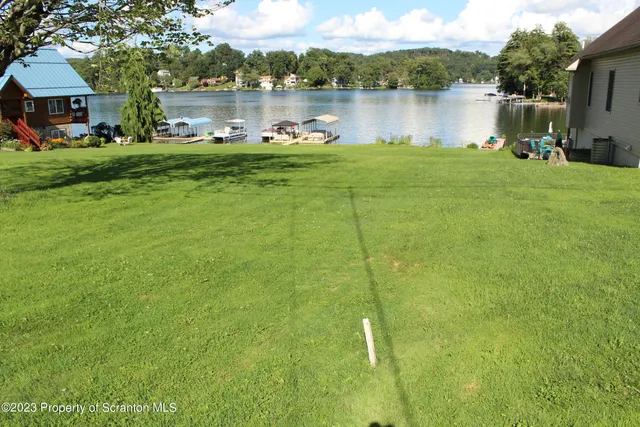 a view of a lake with a house in the background