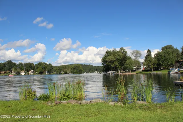 a view of a lake with a big yard
