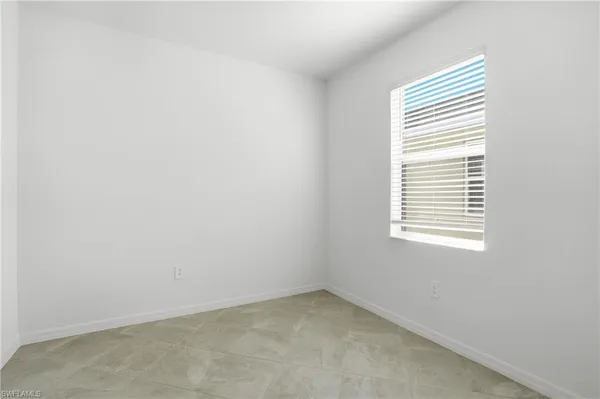 a kitchen with a sink cabinets and wooden floor