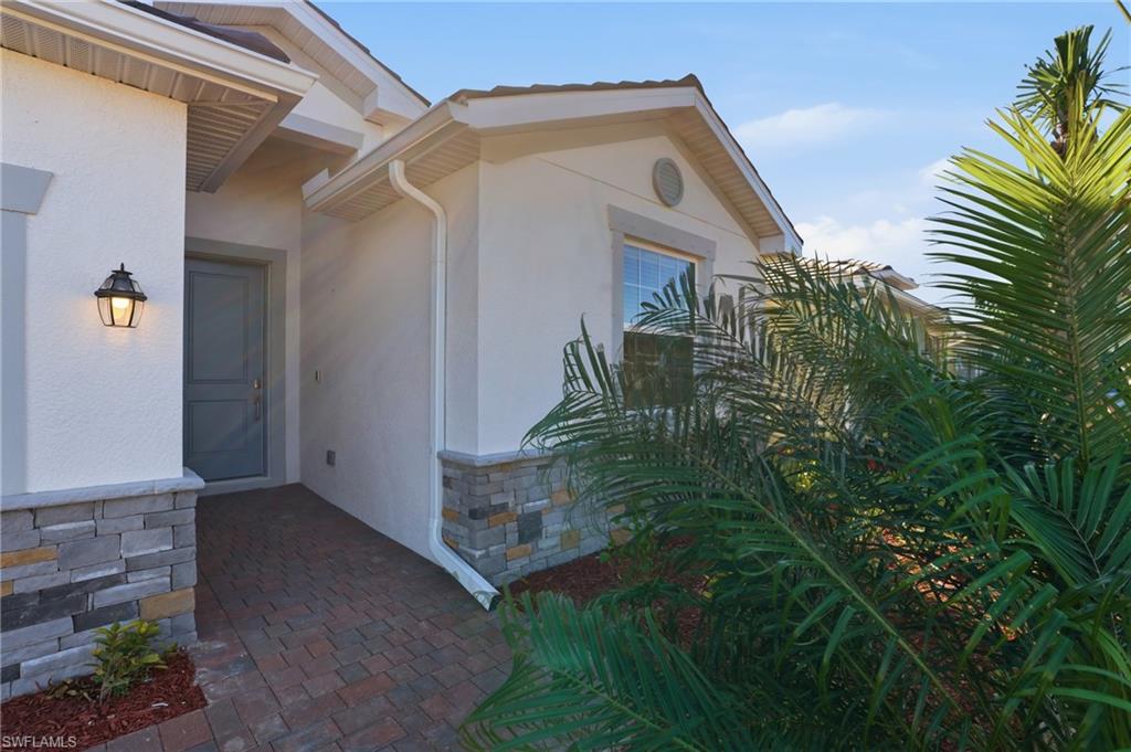 3958 Button Sage Road Alva, FL 33920 - Photo 2 of 50 a view of a house with a yard