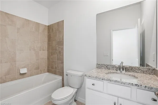 a view of a closet area with an empty room