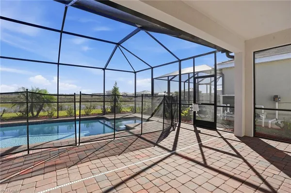 a view of a living room and floor to ceiling window