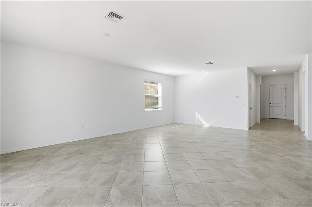 3958 Button Sage Road Alva, FL 33920 - Photo 5 of 50 a view of an empty room with a window