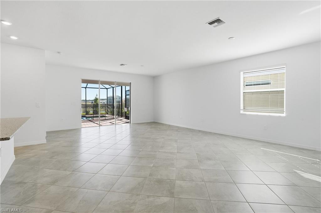 3958 Button Sage Road Alva, FL 33920 - Photo 8 of 50 a view of an empty room with a window