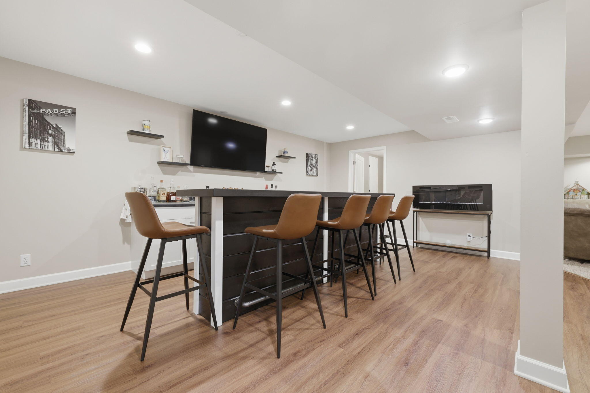 621 Fox Run Lane Mount Pleasant, WI 53406 - Photo 19 of 29 Finished basement with built in bar