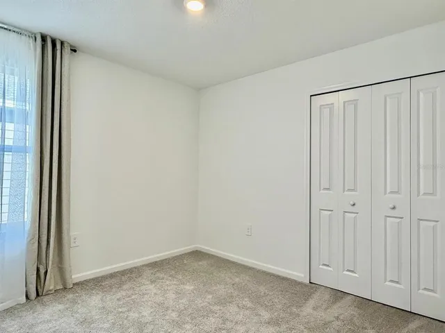 a bathroom with a sink toilet vanity and shower