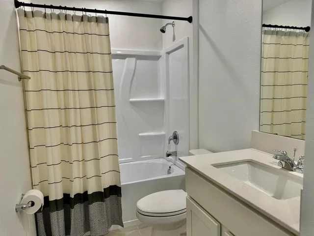 a house that has a swimming pool in front of it