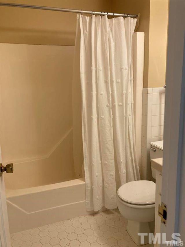 2892 Wycliff Road Raleigh, NC 27607 - Photo 17 of 20 a bathroom with a toilet and shower