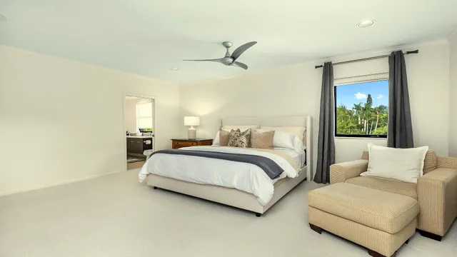 a bathroom with a tub a window and a shower