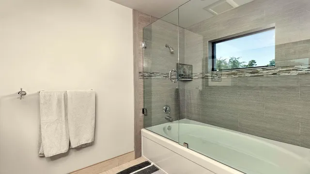 a bedroom with a bed and a table