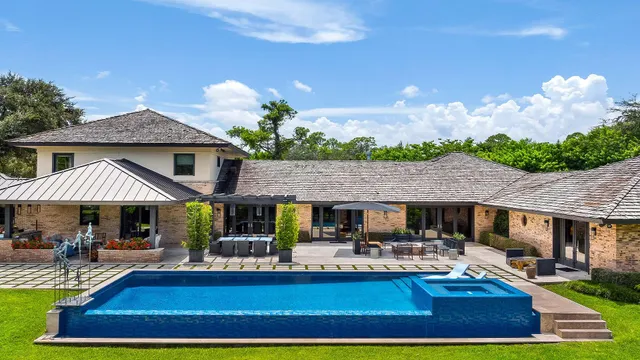 a view of a swimming pool with a patio