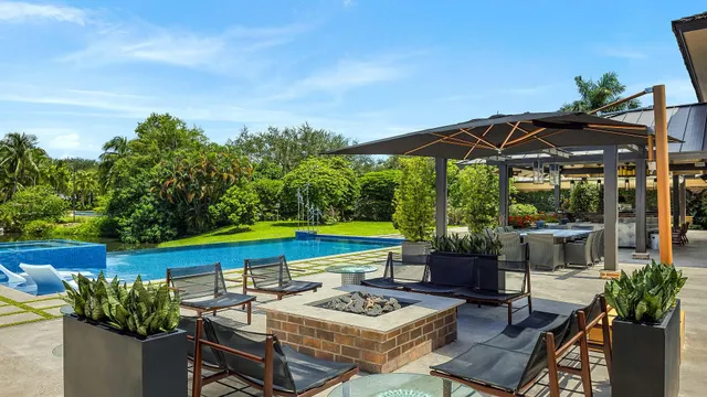 a dining area with furniture and outdoor view